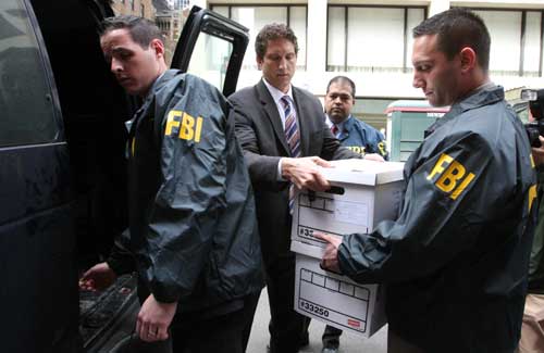 FBI Agents Load Seized Documents From the National Report's Offices